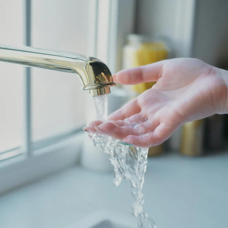 filtered water flowing over hand